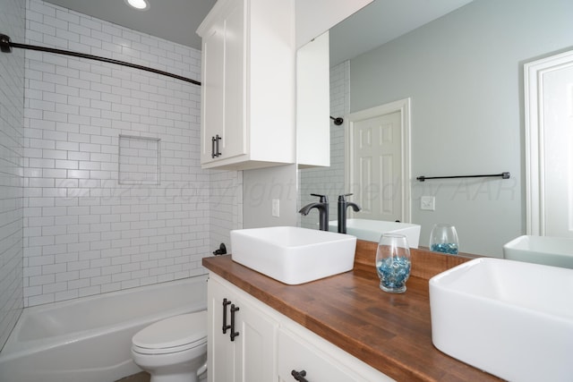 5415 Fm 809, Wildorado, TX 79098 - bathroom featuring double vanity, toilet, tub / shower combination, and recessed lighting