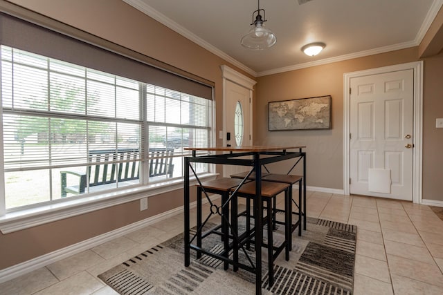 1107 Yucca Ave, Amarillo, TX 79108 - dining space featuring healthy amount of natural light, light tile patterned floors, baseboards, and ornamental molding
