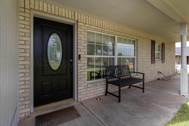 1107 Yucca Ave, Amarillo, TX 79108 - property entrance featuring a porch and brick siding