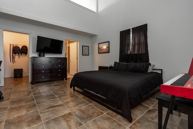1107 Yucca Ave, Amarillo, TX 79108 - tiled bedroom with a high ceiling and baseboards