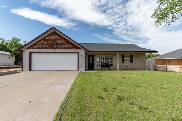 1107 Yucca Ave, Amarillo, TX 79108 - view of front facade with driveway, a garage, and brick siding