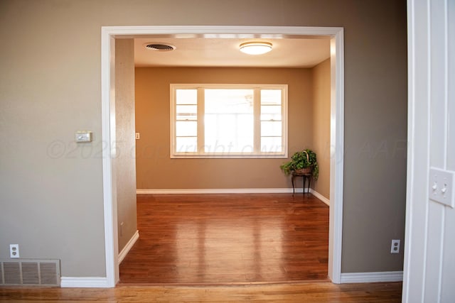 1215 S Main St, Hereford, TX 79045 - hall featuring wood finished floors and baseboards