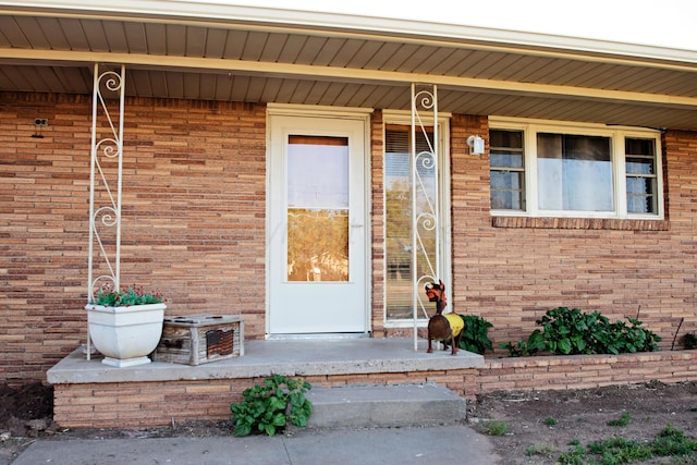 1215 S Main St, Hereford, TX 79045 - property entrance featuring brick siding and covered porch