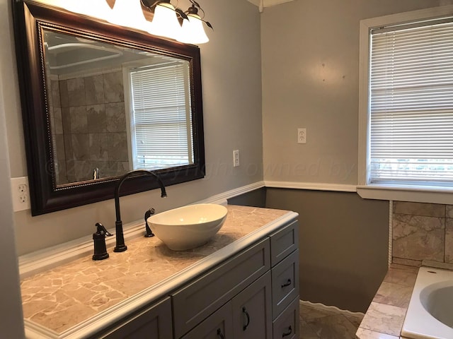 1000 S Bryan St, Amarillo, TX 79102 - full bathroom featuring vanity, a bath, marble finish flooring, and plenty of natural light