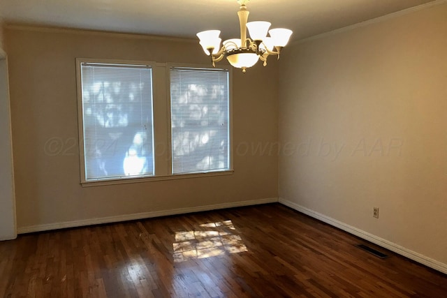 1000 S Bryan St, Amarillo, TX 79102 - spare room with a chandelier, wood finished floors, baseboards, and crown molding