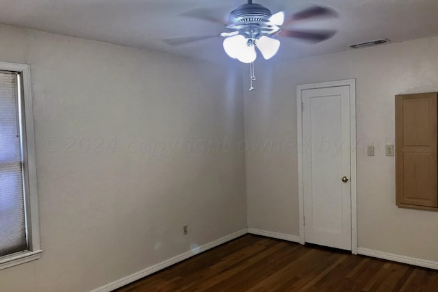 1000 S Bryan St, Amarillo, TX 79102 - empty room with ceiling fan, dark wood-style floors, and baseboards