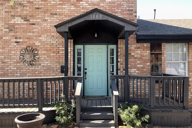 1000 S Bryan St, Amarillo, TX 79102 - entrance to property featuring a shingled roof and brick siding