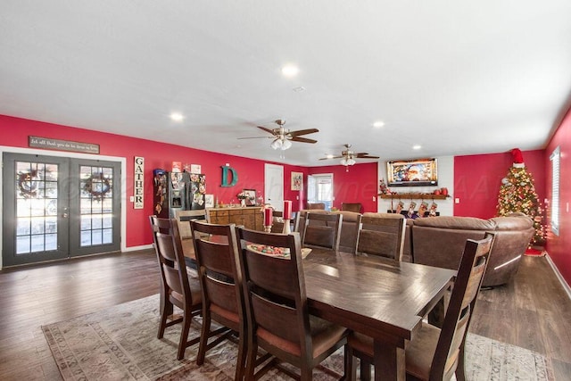 dining space with dark wood-type flooring, recessed lighting, french doors, and baseboards