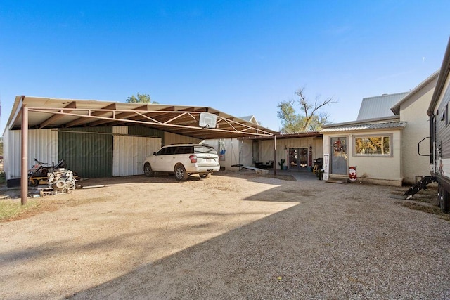 view of vehicle parking featuring a carport