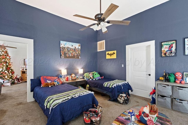 bedroom with carpet floors, visible vents, and a ceiling fan