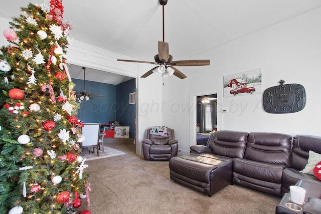 carpeted living room with a ceiling fan