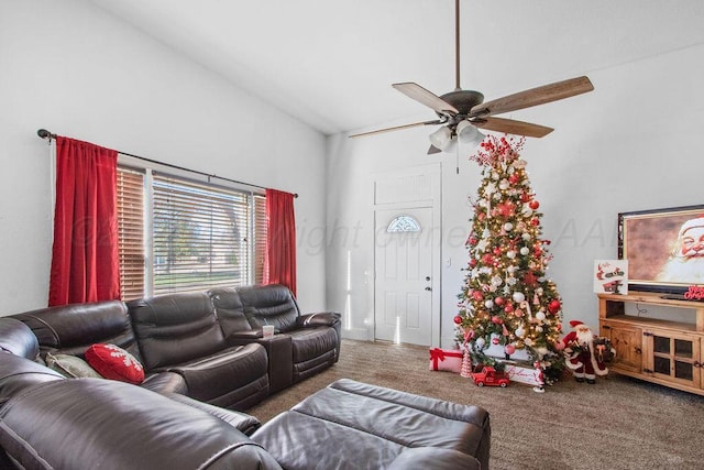 living room with carpet floors, a high ceiling, and a ceiling fan