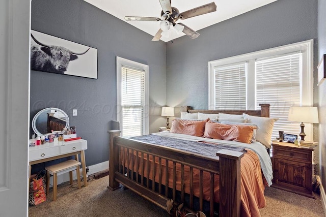 bedroom with carpet floors, ceiling fan, and baseboards