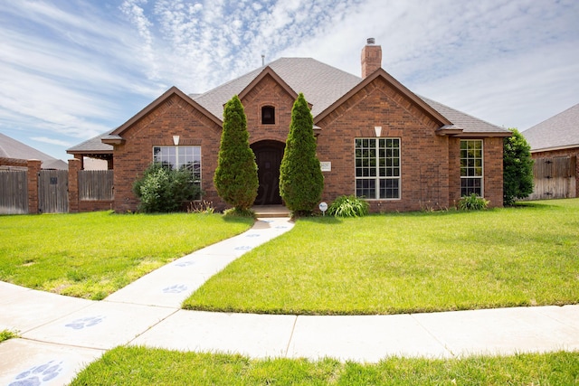 8620 Cortona Dr, Amarillo, TX 79119 - view of front of property with brick siding, a chimney, and roof with shingles
