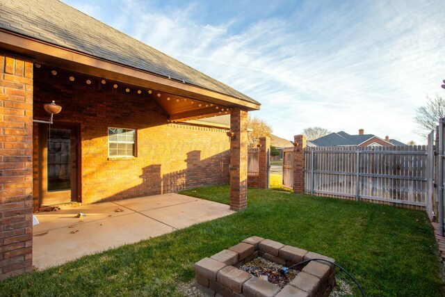 8620 Cortona Dr, Amarillo, TX 79119 - view of yard with a fire pit and a patio area
