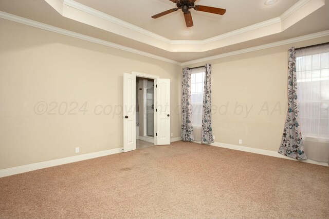 8620 Cortona Dr, Amarillo, TX 79119 - carpeted spare room featuring a raised ceiling, crown molding, a ceiling fan, and baseboards