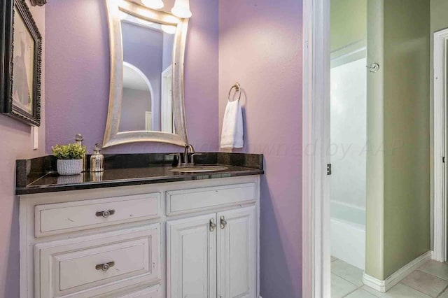 bathroom featuring tile patterned flooring and vanity