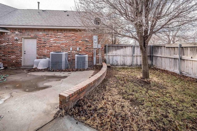 view of yard with a patio area and cooling unit