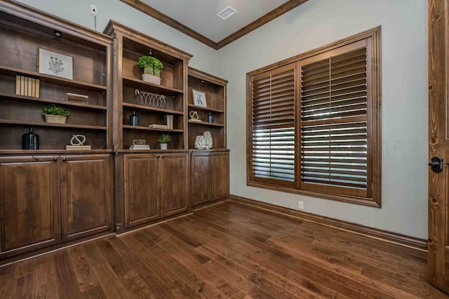 interior space with dark hardwood / wood-style floors and crown molding