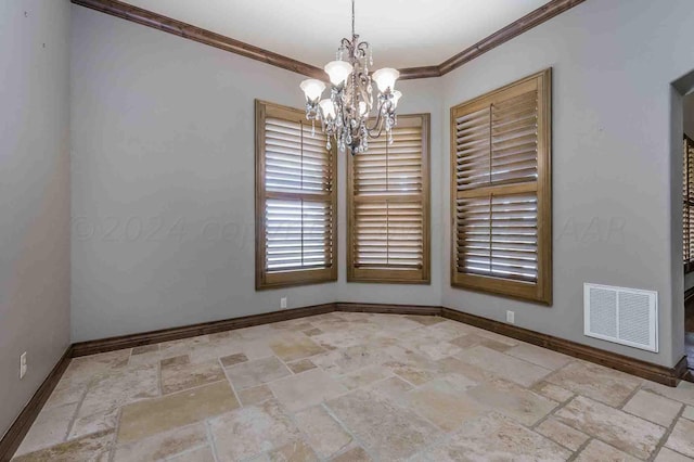 empty room featuring an inviting chandelier and ornamental molding