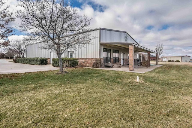 view of property exterior with a yard