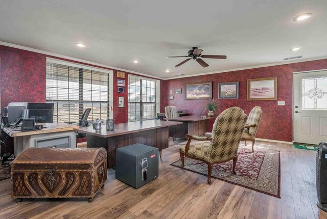 office area with ceiling fan, a healthy amount of sunlight, light hardwood / wood-style flooring, and ornamental molding