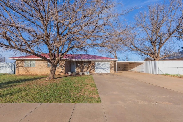 ranch-style house featuring a front lawn, a gate, driveway, fence, and a garage