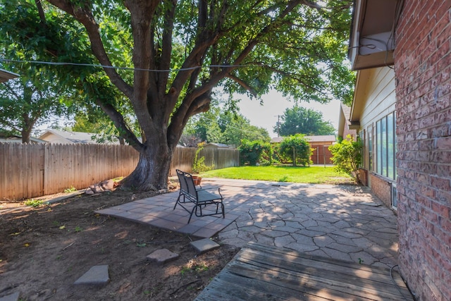 6710 Gainsborough Rd, Amarillo, TX 79106 - fenced backyard with a patio