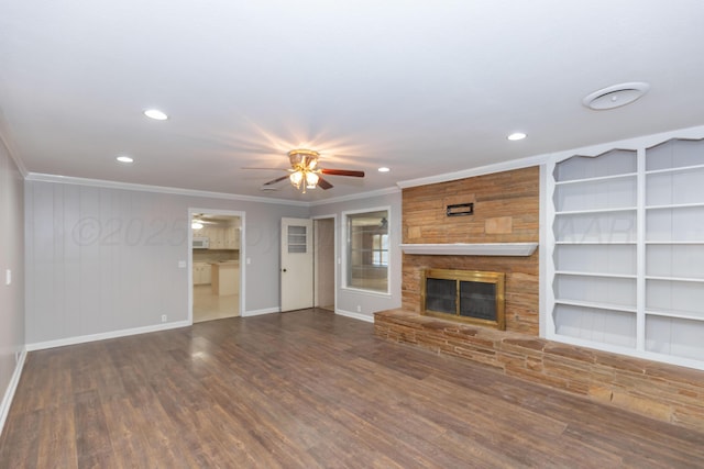 6710 Gainsborough Rd, Amarillo, TX 79106 - unfurnished living room featuring ceiling fan, wood finished floors, crown molding, recessed lighting, and a fireplace