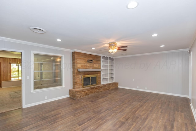 6710 Gainsborough Rd, Amarillo, TX 79106 - unfurnished living room with ornamental molding, a ceiling fan, dark wood-style floors, recessed lighting, and a fireplace