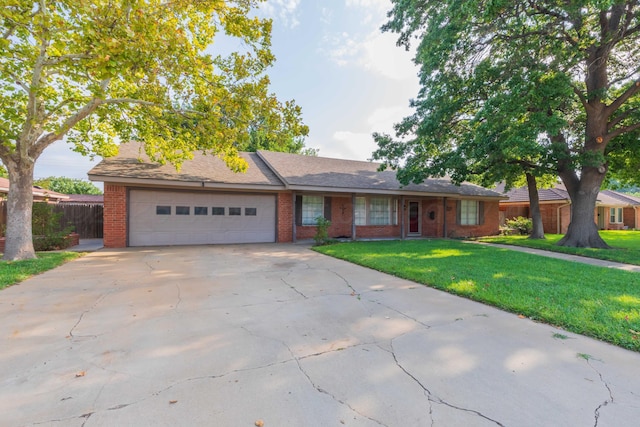 6710 Gainsborough Rd, Amarillo, TX 79106 - single story home featuring brick siding, a garage, and driveway