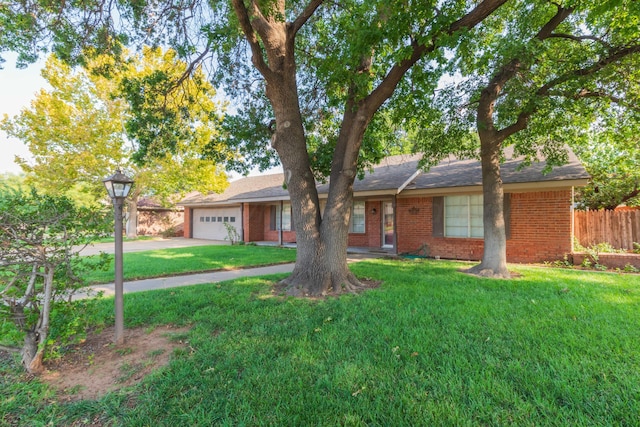 6710 Gainsborough Rd, Amarillo, TX 79106 - ranch-style home with brick siding, a garage, and driveway