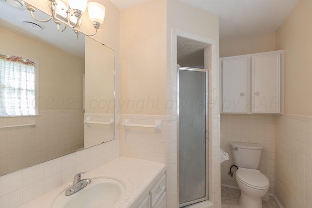 6710 Gainsborough Rd, Amarillo, TX 79106 - full bath featuring tile walls, vanity, a shower stall, and wainscoting