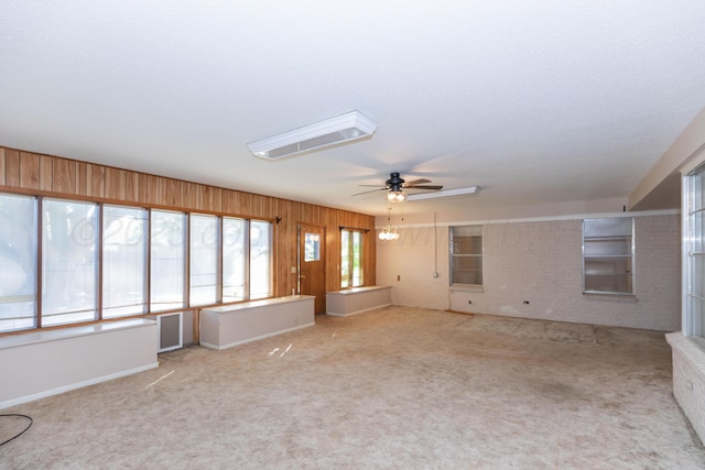 6710 Gainsborough Rd, Amarillo, TX 79106 - unfurnished living room featuring a ceiling fan and carpet