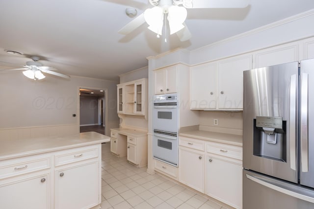 6710 Gainsborough Rd, Amarillo, TX 79106 - kitchen with stainless steel refrigerator with ice dispenser, a ceiling fan, white double oven, light countertops, and light tile patterned floors