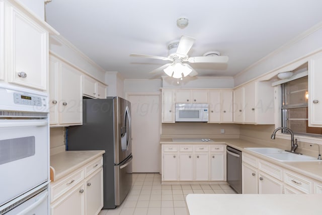 6710 Gainsborough Rd, Amarillo, TX 79106 - kitchen featuring appliances with stainless steel finishes, ceiling fan, light countertops, light tile patterned floors, and ornamental molding