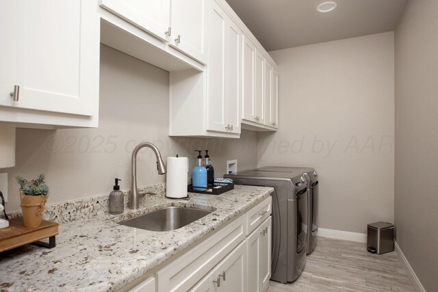 5708 Wesley Rd, Amarillo, TX 79119 - washroom with washing machine and dryer, cabinet space, light wood-type flooring, and recessed lighting