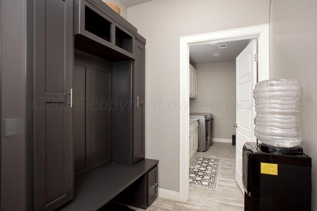 5708 Wesley Rd, Amarillo, TX 79119 - mudroom featuring light wood finished floors and washer and clothes dryer
