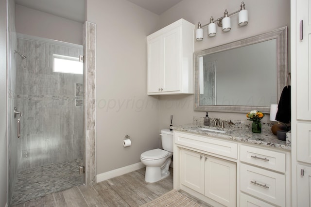 5708 Wesley Rd, Amarillo, TX 79119 - full bath featuring vanity, a stall shower, and wood finished floors