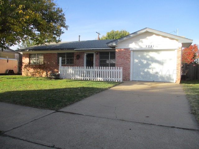 single story home with a front yard and a garage