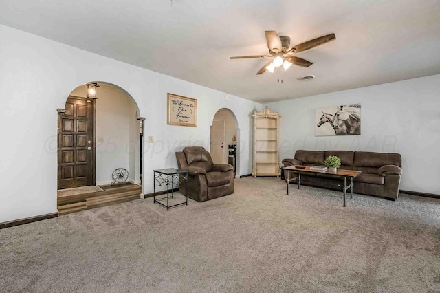 living room featuring ceiling fan and carpet flooring