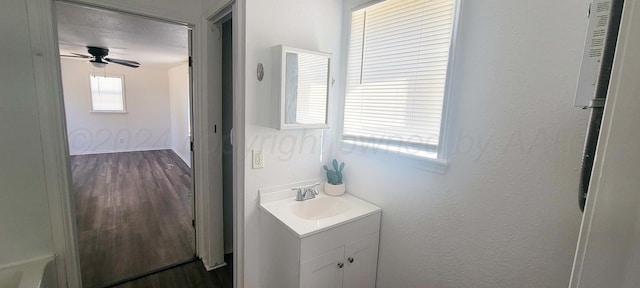 bathroom with ceiling fan and vanity