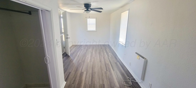 corridor featuring hardwood / wood-style floors