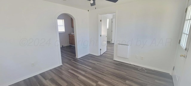 spare room featuring dark hardwood / wood-style floors and ceiling fan