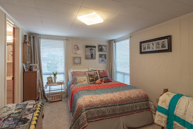 bedroom featuring carpet and crown molding