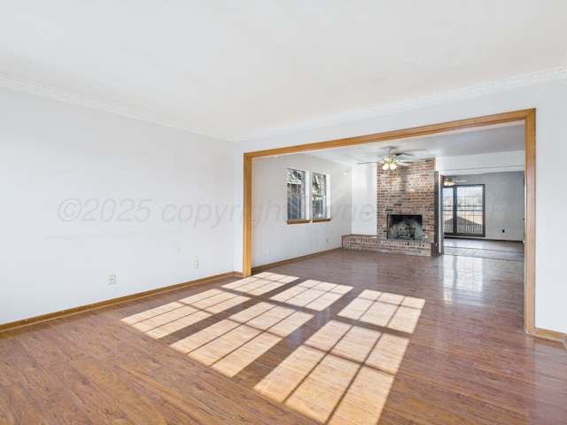 unfurnished living room with ceiling fan, wood finished floors, and a fireplace