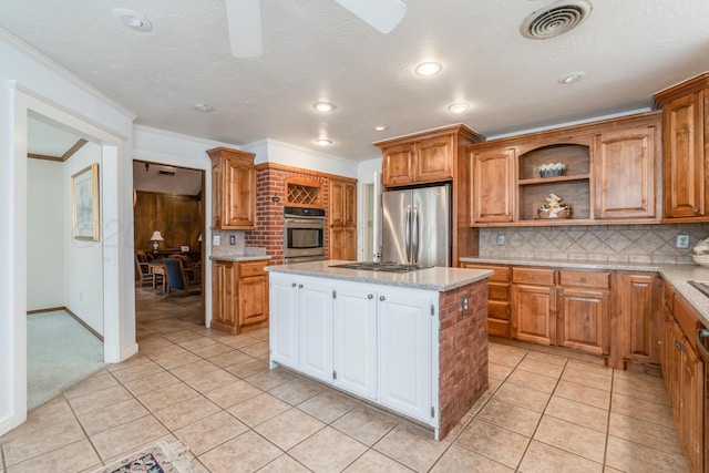 kitchen with open shelves, tasteful backsplash, appliances with stainless steel finishes, and a center island