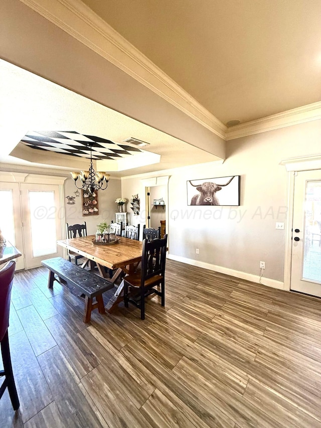 8101 Vail Dr, Amarillo, TX 79118 - dining space featuring ornamental molding, wood finished floors, a chandelier, and baseboards