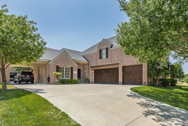 view of front of home featuring a carport, a garage, and a front lawn