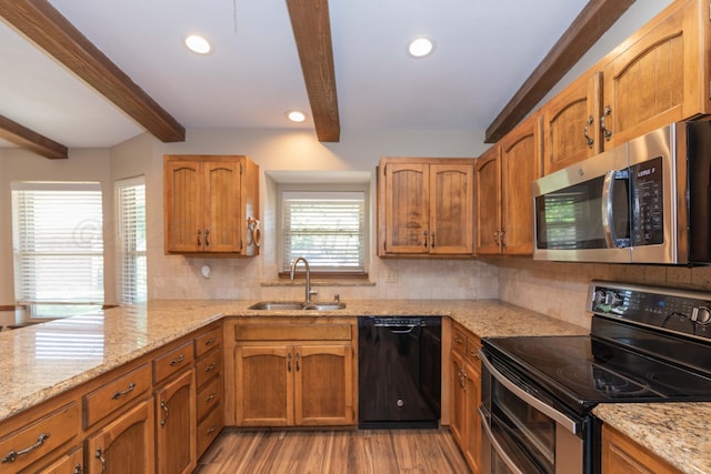 5404 While A Way Rd, Amarillo, TX 79109 - kitchen featuring stainless steel microwave, black dishwasher, range with electric cooktop, a sink, and beam ceiling